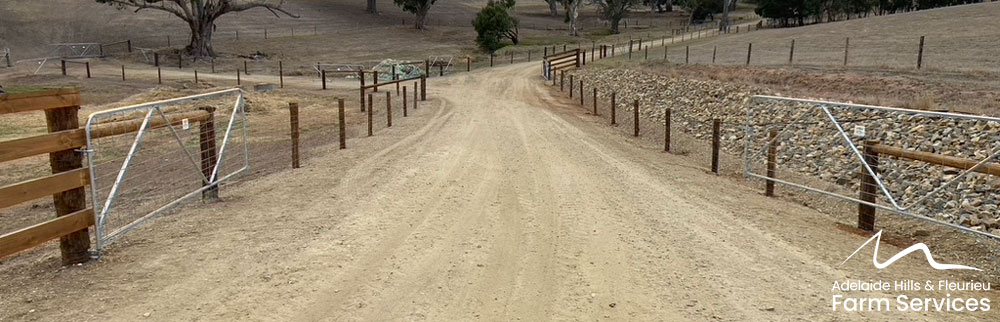 An expansive laneway that allows for the quiet movement of cattle towards the yards. This fence is made with Tanaposts from Roundwood Solutions.